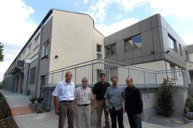 Wolfgang & Stefan Kaiser with production managers in front of extension at the Friedr Freek Factory, Menden, Germany.