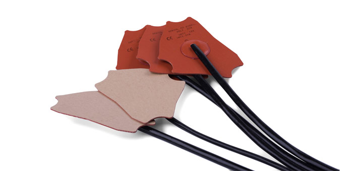 Self-adhesive silicone heater, central termination, with silicone sleeve