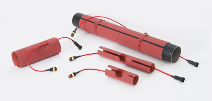 Different preformed silicone heaters for tubes, with silicone straps and plugs to connect some heaters